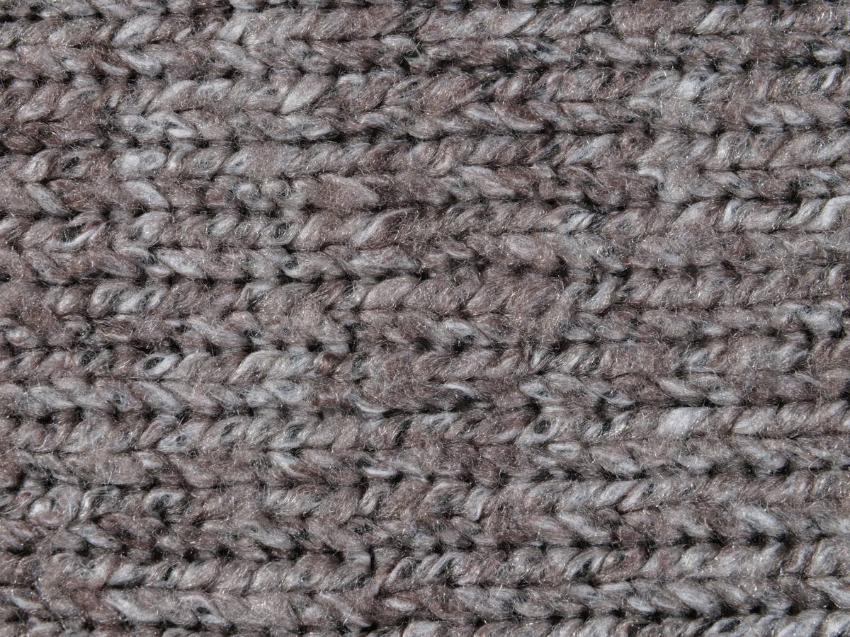Side-by-side comparison showing level-loop berber (left) with visible footprints vs. textured loop berber (right) hiding soil and wear patterns