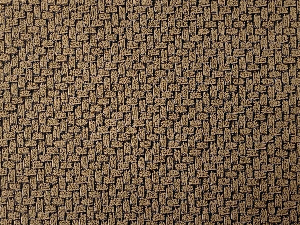 Comparison chart of berber carpet fibers: olefin vs nylon vs wool showing durability, stain resistance, and cost metrics